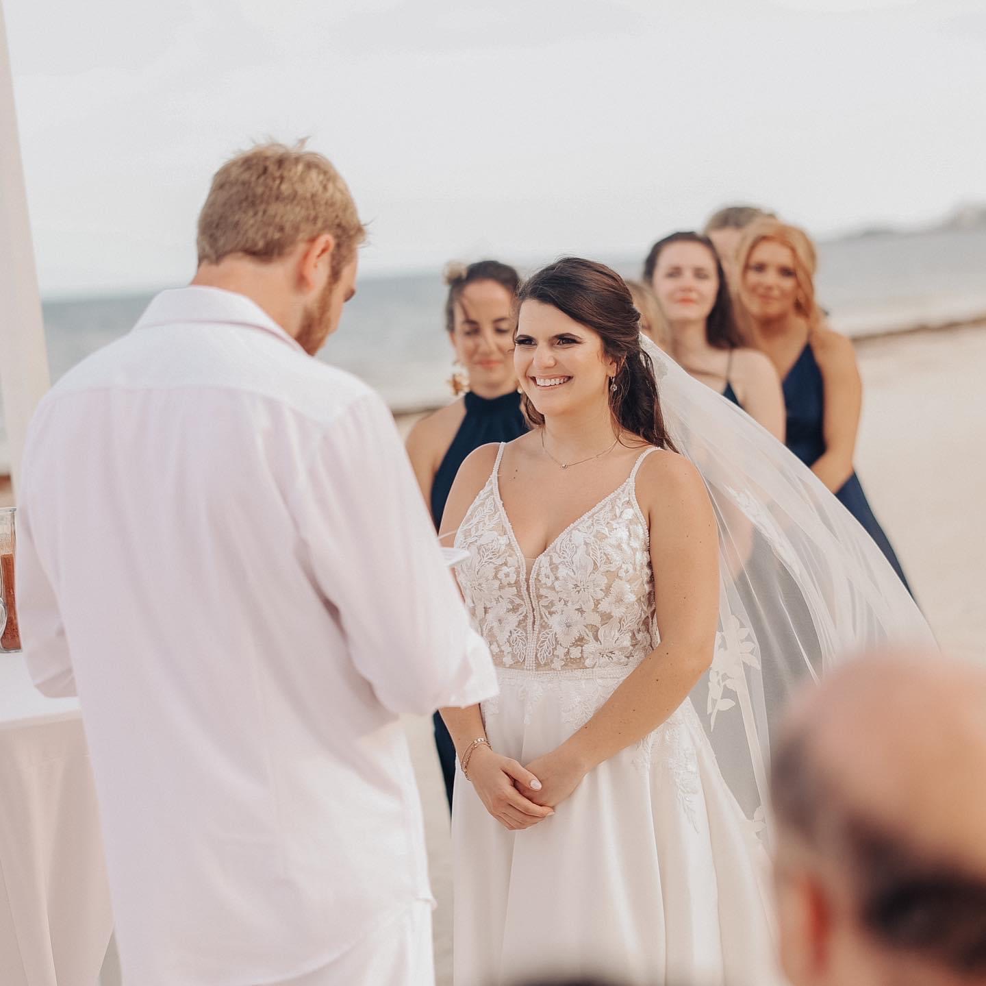 Couple exchanging rings at a destination wedding in Cancun